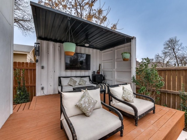 wooden terrace featuring ceiling fan