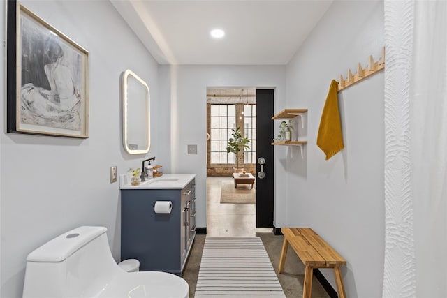 bathroom with vanity and toilet