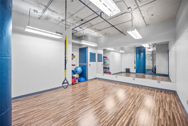 workout room with hardwood / wood-style flooring