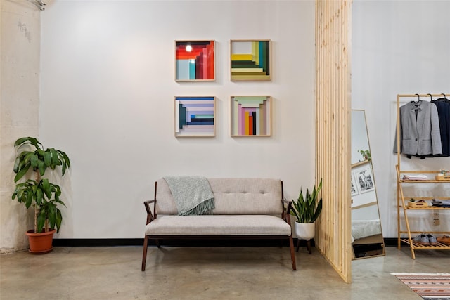 living area with concrete floors