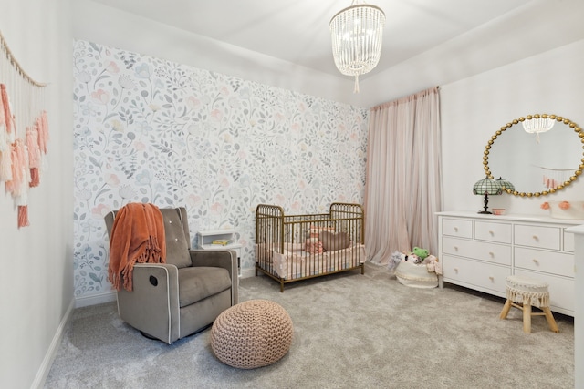 sitting room with an inviting chandelier and light colored carpet