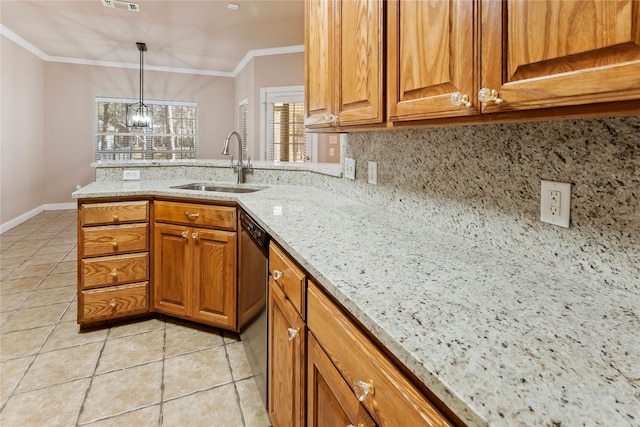 kitchen featuring light stone countertops, sink, hanging light fixtures, ornamental molding, and light tile patterned flooring