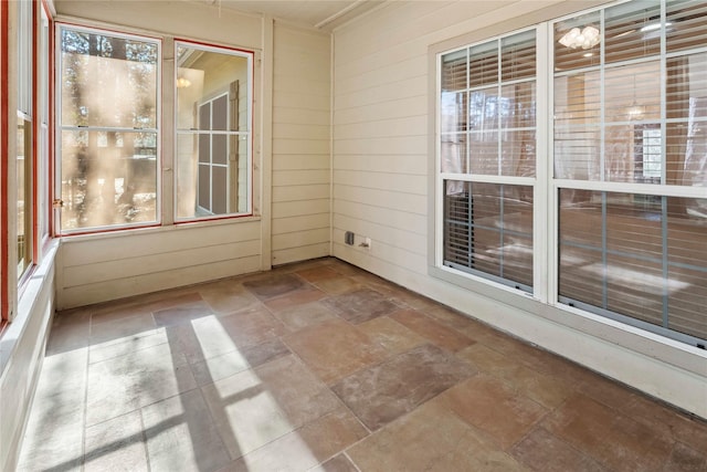 unfurnished sunroom with plenty of natural light