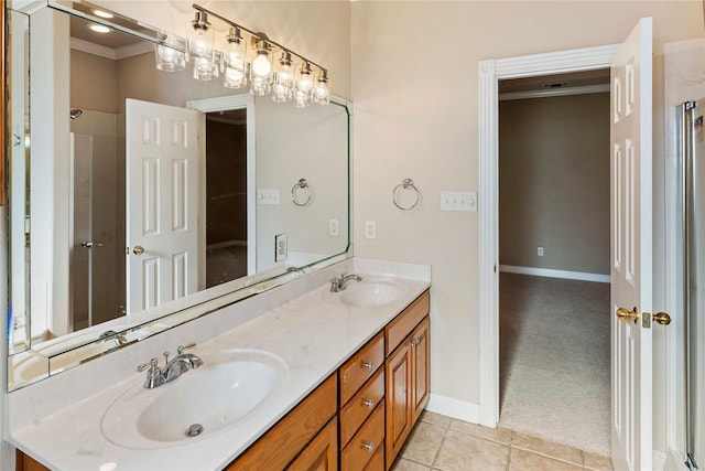 bathroom featuring tile patterned flooring, vanity, and ornamental molding