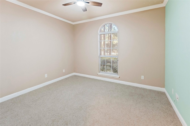 spare room with ceiling fan and ornamental molding