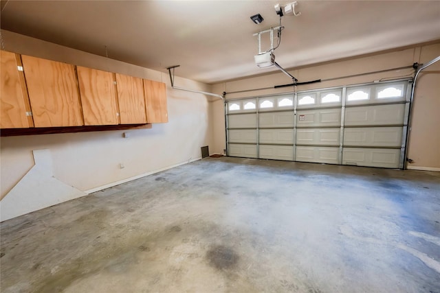 garage featuring a garage door opener