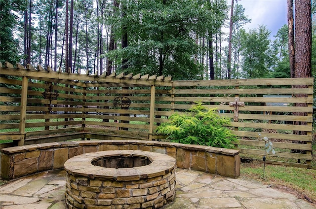 view of patio / terrace with a fire pit