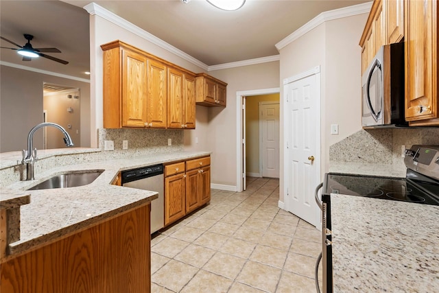 kitchen featuring sink, backsplash, appliances with stainless steel finishes, and light tile patterned flooring