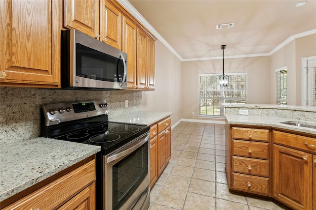 kitchen with backsplash, light tile patterned floors, light stone countertops, and stainless steel appliances