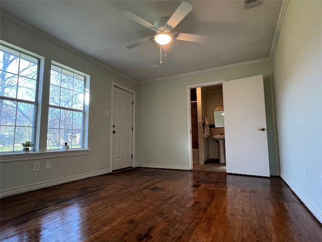 spare room with ceiling fan, dark hardwood / wood-style floors, and crown molding