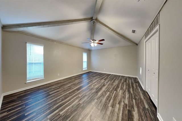 unfurnished room featuring dark wood-type flooring, lofted ceiling with beams, and ceiling fan