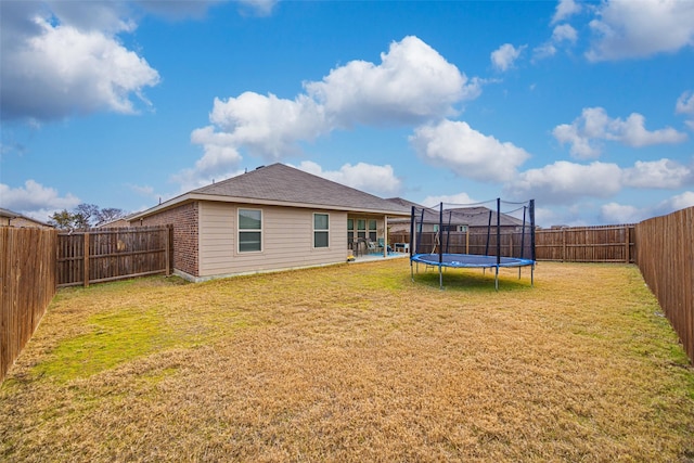 back of house featuring a yard