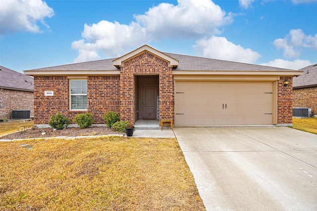 single story home with a garage, central air condition unit, and a front yard