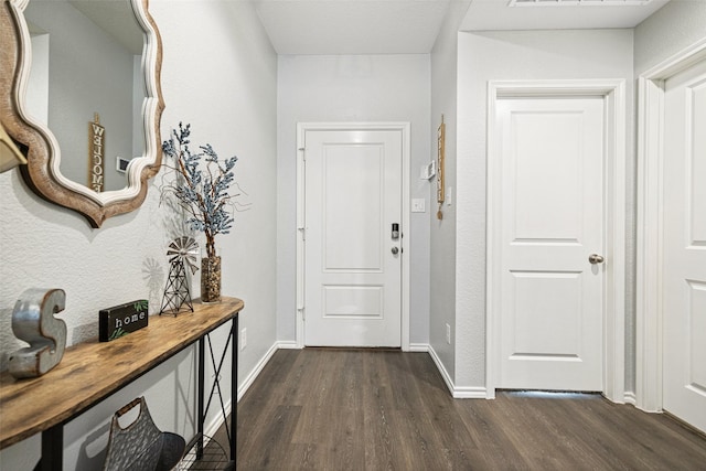 hallway with dark hardwood / wood-style flooring