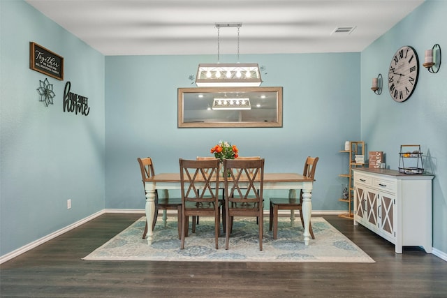 dining room with dark wood-type flooring