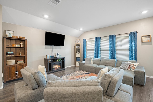 living room with dark wood-type flooring and lofted ceiling