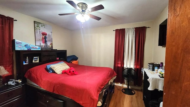 bedroom featuring ceiling fan and hardwood / wood-style flooring