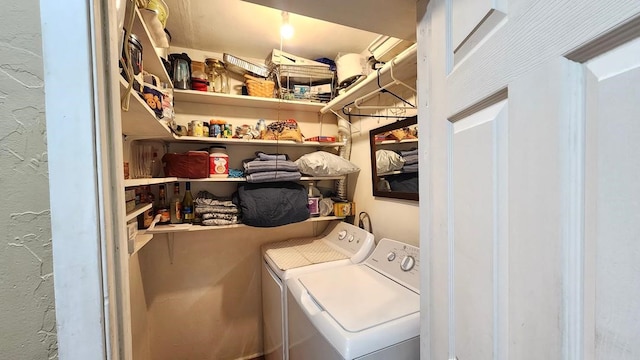 laundry room featuring separate washer and dryer