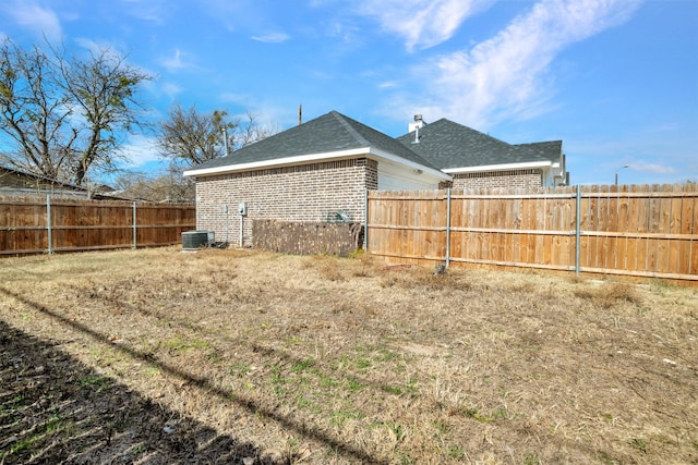 view of yard with central AC unit