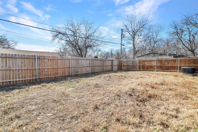 view of yard with central AC unit