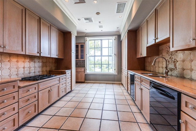 kitchen featuring decorative backsplash, sink, dishwasher, and gas cooktop