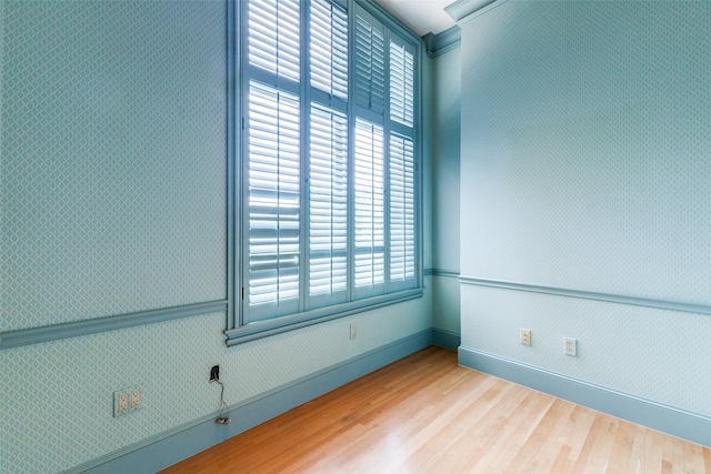 unfurnished room with hardwood / wood-style floors