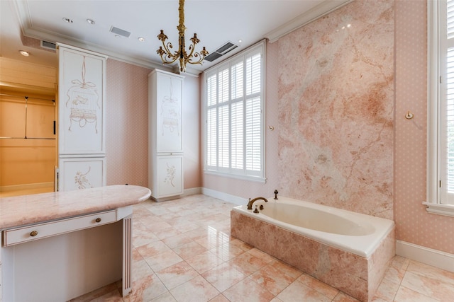 bathroom featuring tiled bath, crown molding, and a notable chandelier