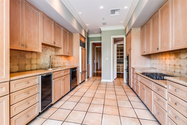 kitchen with decorative backsplash, sink, light brown cabinets, and light tile patterned flooring