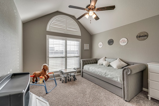 bedroom featuring ceiling fan, carpet floors, and vaulted ceiling