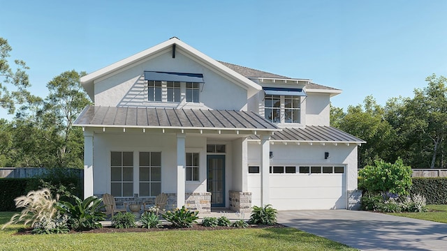 view of front facade with a garage, covered porch, and a front yard