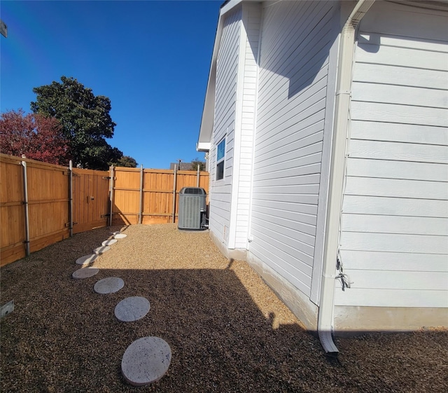 view of yard with central air condition unit