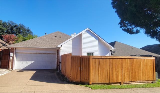 view of property exterior with a garage