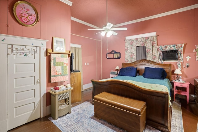 bedroom featuring ceiling fan, hardwood / wood-style flooring, and crown molding