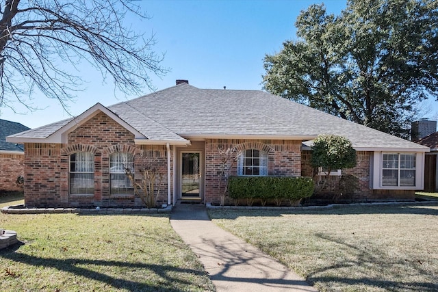 ranch-style home featuring a front yard