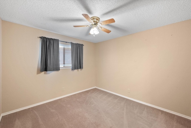 unfurnished room featuring a textured ceiling, carpet floors, and ceiling fan