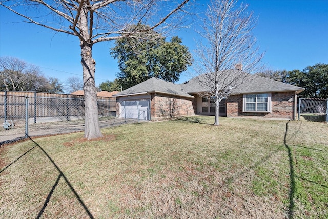 view of front of home featuring a garage and a front lawn