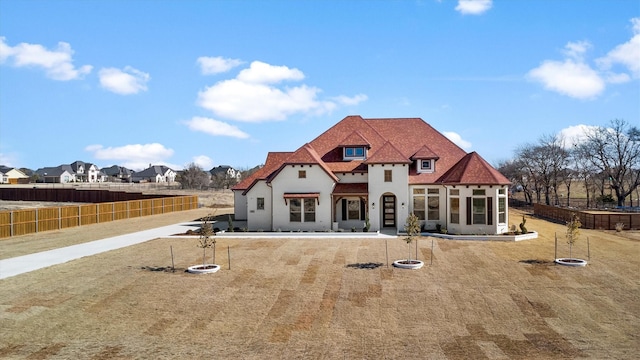 rear view of house with a lawn