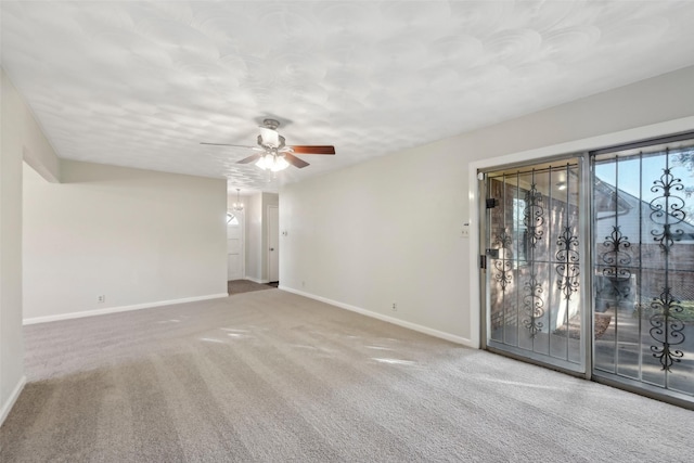 carpeted empty room featuring ceiling fan