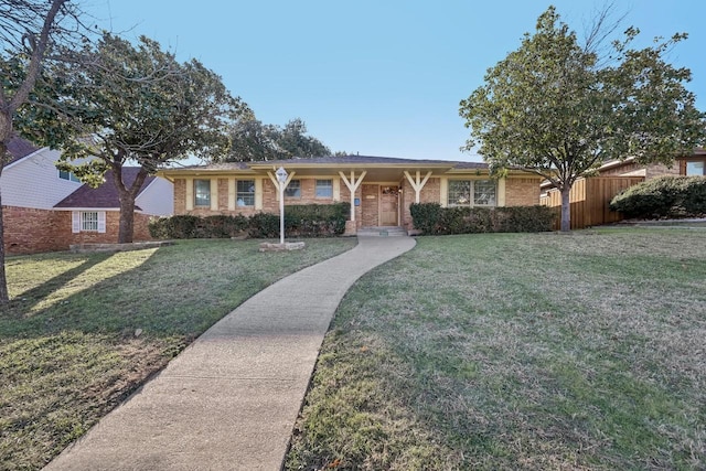 single story home with a front lawn