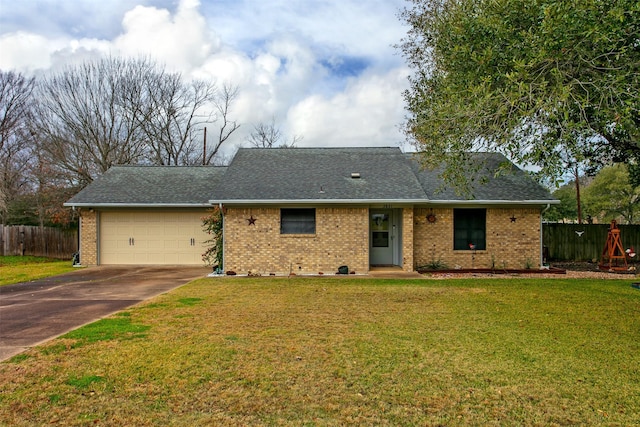 ranch-style home with a front yard and a garage