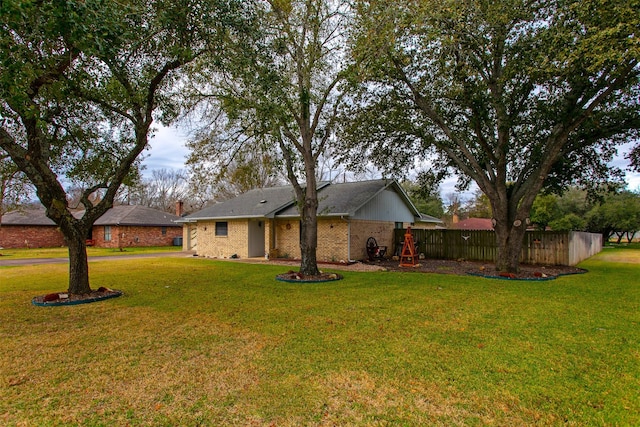 ranch-style house featuring a playground and a front lawn