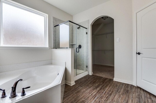 full bath featuring toilet, bathtub / shower combination, wood finished floors, and vanity