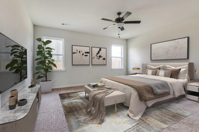 carpeted bedroom featuring visible vents, ceiling fan, and baseboards