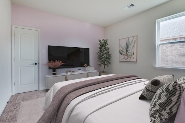 bedroom with light carpet and visible vents