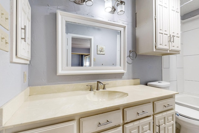 bathroom with vanity and toilet