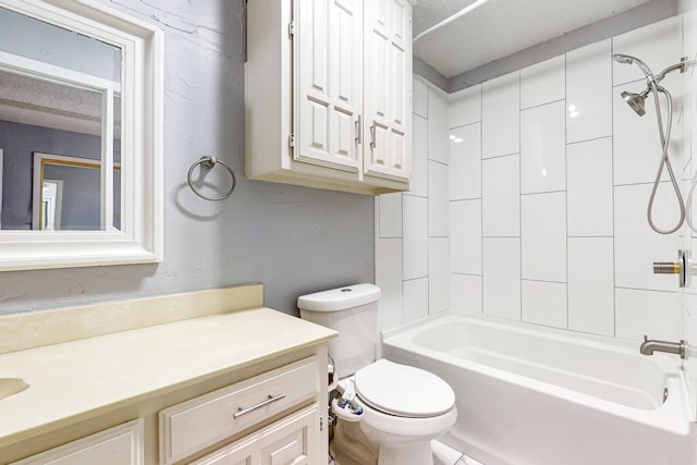 full bathroom with toilet, tiled shower / bath, and vanity