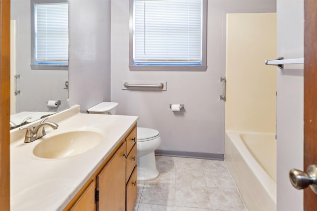 bathroom featuring vanity, toilet, and tile patterned floors