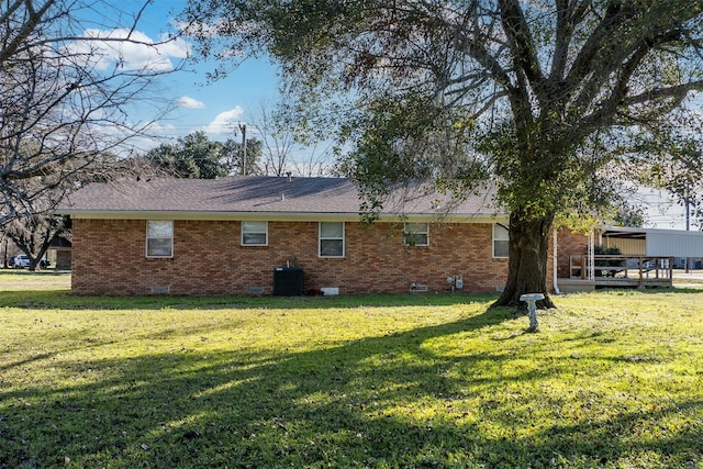 view of home's exterior with a lawn and cooling unit