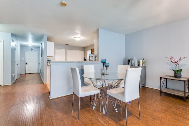 dining room with hardwood / wood-style flooring