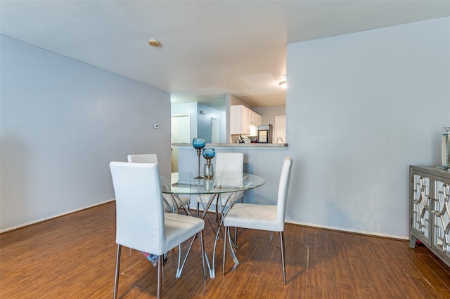 dining room featuring dark hardwood / wood-style floors